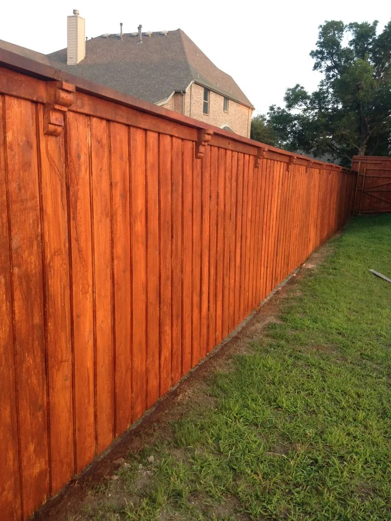 Wood privacy fence with a fresh cedar-tone stain