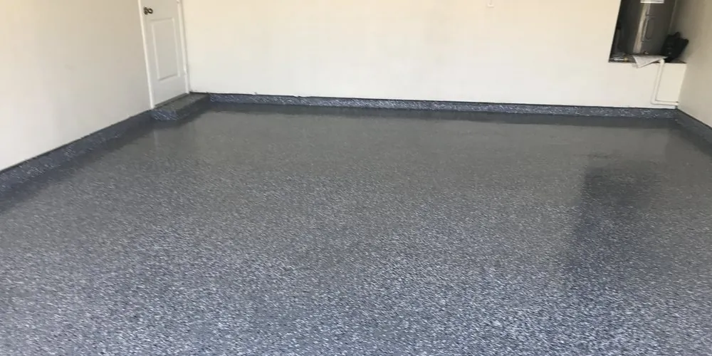 Garage floor finished in a blue-gray flake epoxy coating
